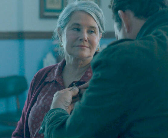 7 Lorraine Bracco looking warmly at Vince Vaughn in a close-up scene from the film Nonnas.