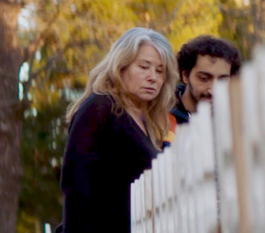 11 Lorraine Bracco and Malek Rahbani walking outdoors in a scene from Jacir.