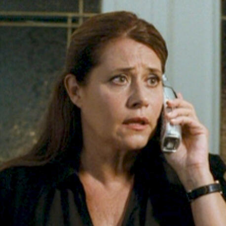 4 Lorraine Bracco on phone with concerned look in Son of Morning.