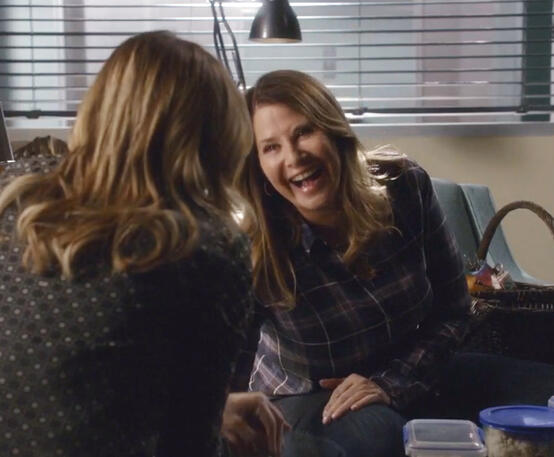 1 Lorraine Bracco as Angela Rizzoli laughing with Maura Isles in a scene from Rizzoli and Isles.