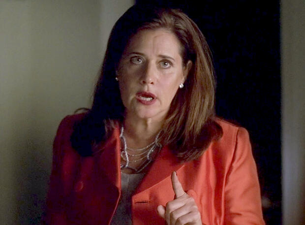 and Lorraine Bracco gesturing in a red jacket on Lipstick Jungle TV series.