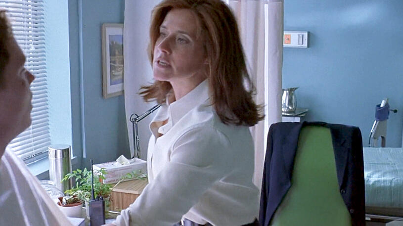 2 Lorraine Bracco grabbing her co-star to arrest him in a Tangled movie scene.