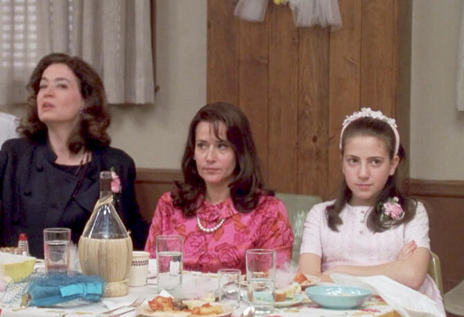 2 Lorraine Bracco sat at the wedding reception table looking very short indeed. Riding in Cars with Boys