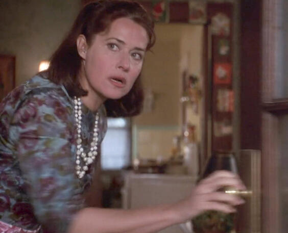 11 Lorraine Bracco in a floral dress and pearl necklace closing a door angrily in Riding in Cars with Boys.