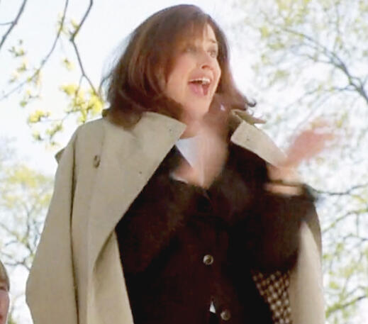 11 Lorraine Bracco hyper and clapping at a sports event for her child outdoors in Custody of the Heart film.