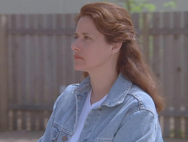 3 Lorraine Bracco in a denim jacket looking sideways in Silent Cradle film.