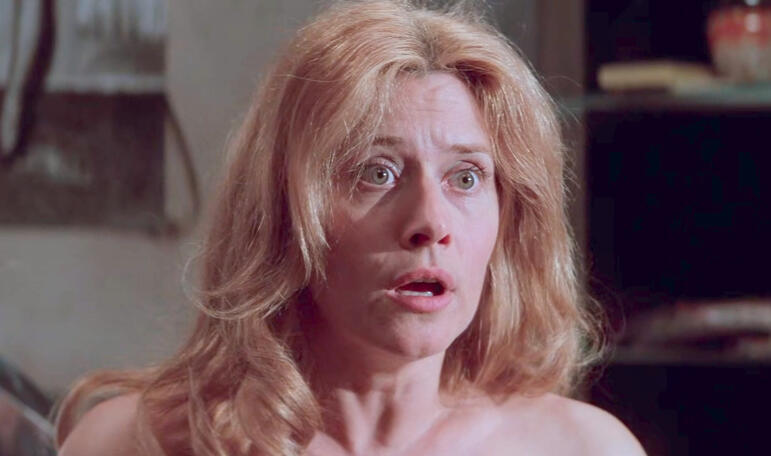 2 Shocked close-up of Lorraine Bracco with wide eyes in a scene from the film Hackers.