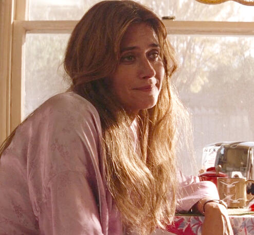 12 Close-up of Lorraine Bracco looking wistful in soft indoor sunlight in the film Radio Flyer.