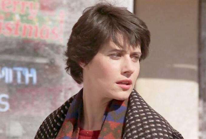 8 Close up of Lorraine Bracco looking concerned in a patterned scarf from the film Sing 1989.