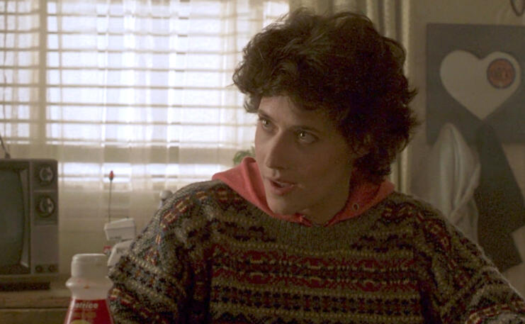 1 Lorraine Bracco wearing a patterned sweater in a scene from Someone to Watch Over Me.